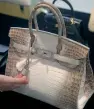  ?? AFP ?? The rare Himalaya Niloticus Crocodile Diamond Birkin 30 is dubbed as ‘the most desirable handbag in existence’. —