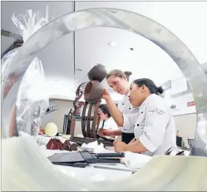  ?? Photo: JUN TANLAYCO/NEW ZEALAND CHOCOLATE FESTIVAL ?? Working together:
Jiemin Aw and Sarah Harrap say teamwork is essential.