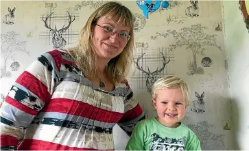  ??  ?? Sarah de Reeper, with her son Mason, 2, is ‘gutted’ after the Southern District Health Board cancelled her booking at the Lumsden Maternity Centre after saying it would honour all bookings.