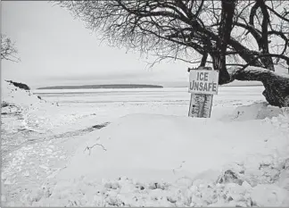  ??  ?? A sign marks the approach to the would-be ice road between Madeline Island and Bayfield, Wisconsin.