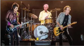  ?? (AP file photo) ?? Charlie Watts and fellow Rolling Stones Ronnie Wood (left) and Keith Richards perform July 15, 2019, in New Orleans. Watts was often ranked with Keith Moon, Ginger Baker and a handful of others as a premier rock drummer.