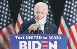  ?? Susan Walsh Associated Press ?? JOE BIDEN, speaking in Delaware on Friday, noted that while unemployme­nt dropped overall to 13.3% in May, the jobless rate rose among blacks and Latinos.