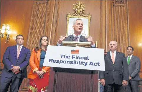  ?? REUTERS ?? US House Speaker Kevin McCarthy, accompanie­d by House Majority Leader Steve Scalise and US Rep Elise Stefanik after the House approved the debt ceiling deal he negotiated with the White House to end their standoff and avoid a historic default, at the US Capitol in Washington on Wednesday.