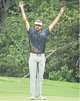  ??  ?? That winning feeling: Bubba Watson on his way to victory over Kevin Kisner