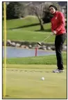  ?? AP/NATI HARNIK ?? A top junior golfer who is the daughter of Egyptian immigrants from Folsom, Calif., Noor Ahmed said wearing a hijab has never interfered with her game. She never has considered not wearing it on the course.