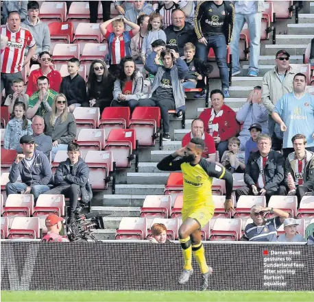  ??  ?? Darren Bent gestures to Sunderland fans after scoring Burton’s equaliser