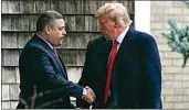  ?? FRANK FRANKLIN II / AP ?? New York City Police Commission­er Edward A. Caban, left, shakes hands with former President Donald Trump as he arrives for the wake of police officer Jonathan Diller on Thursday in Massapequa Park, N.Y.