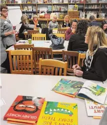  ?? Brian A. Pounds/Hearst Connecticu­t Media ?? Volunteer readers gather in the library of Bryant School in Bridgeport before heading off to classrooms for the 33rd Annual Read Aloud Day in Bridgeport in 2018.