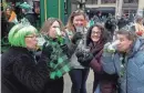  ?? ?? Michelle Siergiej, from left, Valerie Miller, Erica Noah, Nadia Spencer and Heather Fullbrick enjoy a girls weekend with green beer outside Mo’s Irish Pub.