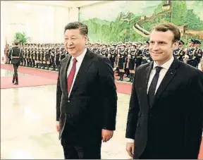  ?? LUDOVIC MARIN / AFP ?? Xi Jinping y Emmanuel Macron ayer en Pekín