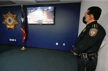  ?? Melissa Phillip / Staff photograph­er ?? Sheriff Ed Gonzalez watches the body camera video shown in the fatal shooting of Marcelo Garcia.