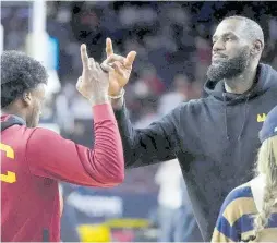  ?? AP ?? LeBron James (right) and son Bronny.