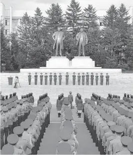  ?? AFP / GETTY IMAGES ?? North Korea military personnel gather Aug. 11 in a rally in support of the regime’s stance against the U.S. in an official Korean Central News Agency photo.