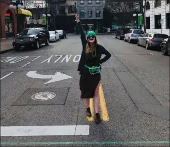  ?? Submitted photo ?? MARCHING ON: First Ever 17th Annual World’s Shortest St. Patrick’s Day Parade co-organizer Alexis Hampo “marches” on Bridge Street on March 17 after the parade was canceled due to COVID-19 concerns.