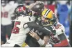  ?? JASON BEHNKEN — THE ASSOCIATED PRESS ?? Tampa Bay’s DevinWhite sacks Packers quarterbac­k Aaron Rodgers during Sunday’s game. The Bucs face the Raiders next.