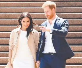  ?? Picture: GETTY IMAGES ?? IN LOVE: Prince Harry and his wife Meghan are on a 16-day tour of Australia and the South Pacific. They are also expecting their first child.