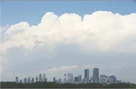  ?? JIM WELLS ?? Dark clouds form over Calgary on Thursday afternoon. A tornado alert was announced then cancelled about 45 minutes later.