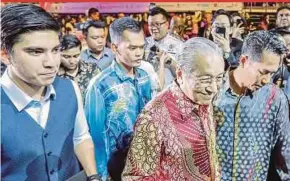  ?? PIC BY AIZUDDIN SAAD ?? Prime Minister Tun Dr Mahathir Mohamad arriving at the My Voice, My Nation Malaysia 2019 public speaking concert at Axiata Arena in Bukit Jalil, Kuala Lumpur, yesterday. With him is Youth and Sports Minister Syed Saddiq Syed Abdul Rahman.