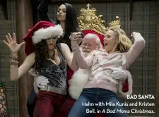  ??  ?? bad santa Hahn with Mila Kunis and Kristen Bell, in A Bad Moms Christmas.