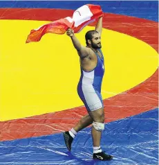  ?? CAMERON SPENCER/GETTY IMAGES FILES ?? Arjan Bhullar celebrates winning the 120-kg freestyle wrestling gold medal at the 2010 Commonweal­th Games.