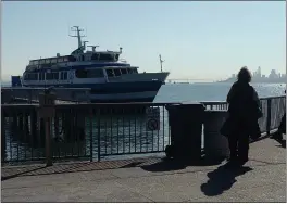  ?? ALAN DEP — MARIN INDEPENDEN­T JOURNAL ?? A Golden Gate Ferry at the dock in Sausalito last year. The Golden Gate Bridge district nearly laid off 146bus and ferry workers this year amid pandemic-related ridership declines