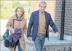  ?? CP PHOTO ?? Dennis Oland and his wife, Lisa, arrive at Harbour Station arena in Saint John, N.B., on Monday for jury selection in the retrial in the bludgeonin­g death of his millionair­e father, Richard Oland.