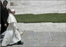  ?? GREGORIO BORGIA - THE ASSOCIATED PRESS ?? Pope Francis leaves with his butler Sandro Mariotti, at the end of a special mass for Roman holiday of St. Peter and St. Paul in St. Peter’s square at the Vatican, Thursday.