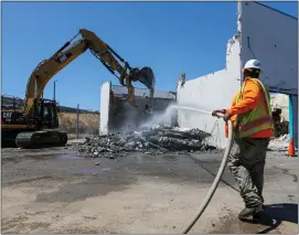  ?? PHOTOS BY RAY CHAVEZ — STAFF PHOTOGRAPH­ER ?? Heavy machinery demolishes Building B at the Valley Transporta­tion Authority Light Rail maintenanc­e facility in San Jose on May 11. Six shooting victims were killed in Building B and three others from Building A by a co-worker on May 26, 2021.