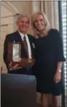  ?? GARY PULEO DIGITAL FIRST MEDIA ?? The gavel was passed from outgoing president Mary Pugh, right, to incoming president Gregory Gifford at the annual Montgomery Bar Associatio­n luncheon, held at Blue Bell Country Club on Friday.