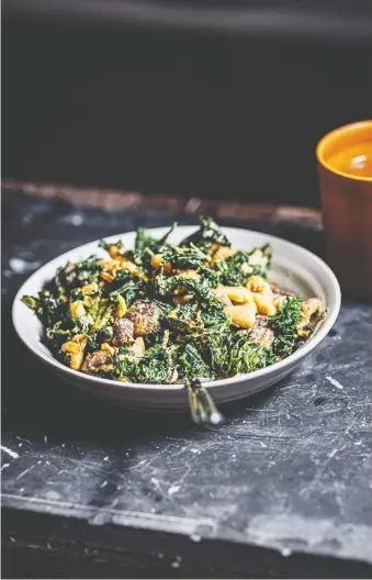  ?? NIK SHARMA ?? Nik Sharma's warm kale salad is perfect served over rice with a spoonful of chutney.