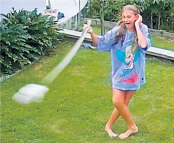  ?? ?? Security camera footage shows Rosie Whitman whirling the 6ft-long snake ‘like a hammer thrower’ to prevent it swallowing her pet guinea pig in her family’s back garden in Queensland, Australia