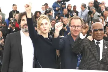  ??  ?? Photocall for the documentar­y film The State Against Mandela and the Others presented as part of special screenings in Cannes, France on May 14. (From left to right) director Nicolas Champeaux cast member Andrew Mlangeni and producer Julie Gayet...