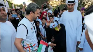  ?? Photos by Ryan Lim ?? Sheikh Abdullah bin Zayed Al Nahyan interacts with participan­ts of the Tolerance Walk during the launch of the National Tolerance Festival at Umm Al Emarat Park in Abu Dhabi. —