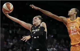  ?? AP PHOTO/ JOHN LOCHER ?? Las Vegas Aces guard Kayla McBride shoots around Phoenix Mercury forward DeWanna Bonner during the second half of a WNBA basketball game on Wednesday, in Las Vegas.