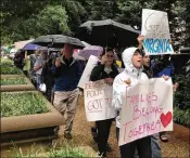  ?? JUSTIN WM. MOYER / WASHINGTON POST ?? In Washington, D.C. on Saturday, protesters rallied outside the Justice Department against family separation­s at the border, one of several demonstrat­ions in the Washington area.