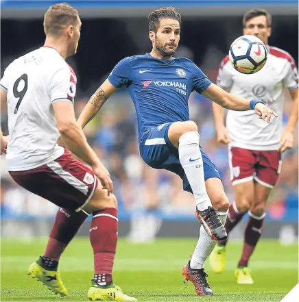  ??  ?? ■ Chelsea’s Cesc Fabregas – soon to be sent off – controls the ball under pressure from Sam Vokes.