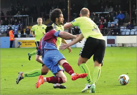  ??  ?? Sean Brennan of Drogheda United in challenged by Limerick duo Bastien Hery and Robbie Williams.