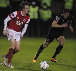  ??  ?? Chris Forrester of St Patrick’s Athletic is tracked by Dundalk’s David McMillan.