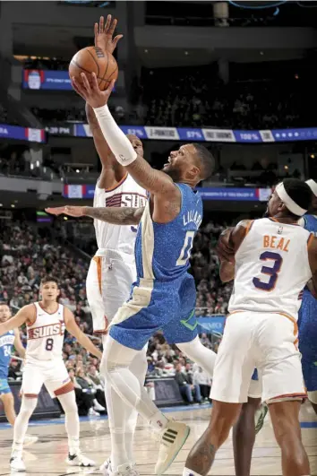  ?? AGENCE FRANCE PRESSE ?? Damian Lillard #0 of the Milwaukee Bucks drives to the basket during the game against the Phoenix Suns at the Fiserv Forum Center in Milwaukee, Wisconsin.