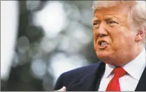  ?? Evan Vucci / Associated Press ?? President Donald Trump talks with reporters on the South Lawn of the White House before departing for the American Farm Bureau Federation’s 100th annual convention in New Orleans on Monday.