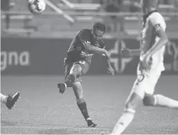  ?? BRAD HORRIGAN/HARTFORD COURANT ?? Hartford Athletic midfielder Danny Barrera fires a shot toward goal against Philadelph­ia Union II on July 25 at Dillon Stadium.