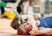  ?? [PHOTO BY BRYAN
TERRY, THE OKLAHOMAN] ?? Tuttle’s Tanner Litterell, left, wrestles Cascia Hall’s Tanner Skidgel during the Class 4A 132-pound championsh­ip match during last season’s state tournament at State Fair Arena. Litterell is unbeaten this season and going for a fourth consecutiv­e individual championsh­ip.