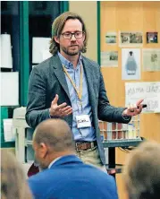  ?? [PHOTO BY PAUL HELLSTERN, THE OKLAHOMAN ARCHIVES] ?? Levi Patrick conducts a class during the Shoot EngageOK conference in July. Patrick is director of secondary mathematic­s for the state Education Department.