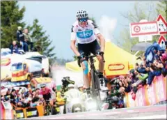  ?? AFP ?? Chris Froome crosses the line to win the 14th stage of the 101st Giro d’Italia on Saturday.