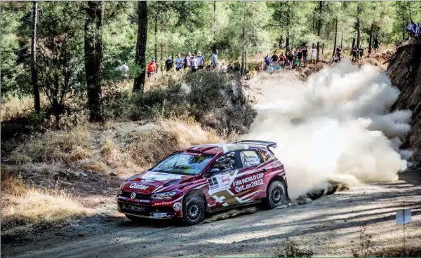  ??  ?? Spectators watch as Qatar’s Nasser Al Attiyah negotiates a sharp downhill turn on the opening day of the two-day Cyprus Rally 2020 on Saturday. Attiyah won three of the first five stages.