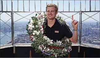  ?? SETH WENIG / AP ?? Marcus Ericsson of Sweden poses for pictures on the observatio­n desk of the Empire State Building in New York, on Tuesday, May 31.