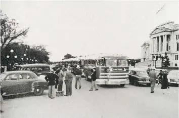  ?? SASKATCHEW­AN ARCHIVES BOARD PHOTOGRAPH NO. 54-063-01 ?? Chartered Saskatchew­an Transporta­tion Company buses line up in front of the Legislativ­e Building in Regina in June 1954