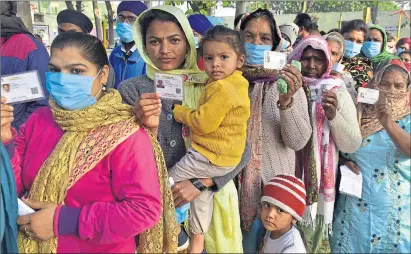  ?? ?? Voters show identity cards during Punjab state assembly election in February in Amritsar, India