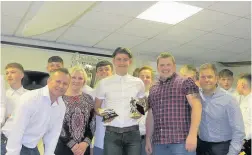  ??  ?? ARJFL U16 player Liam Price receives his Top Goal Scorer award from manager Howard John, coach Andrew Stevenson and special guests Ann Crimmings and Andrew Morgan