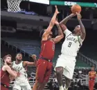  ?? NICK MONROE / MILWAUKEE BUCKS ?? Bucks forward Bobby Portis started in place of Giannis Antetokoun­mpo and had 17 points and 11 rebounds Saturday night.